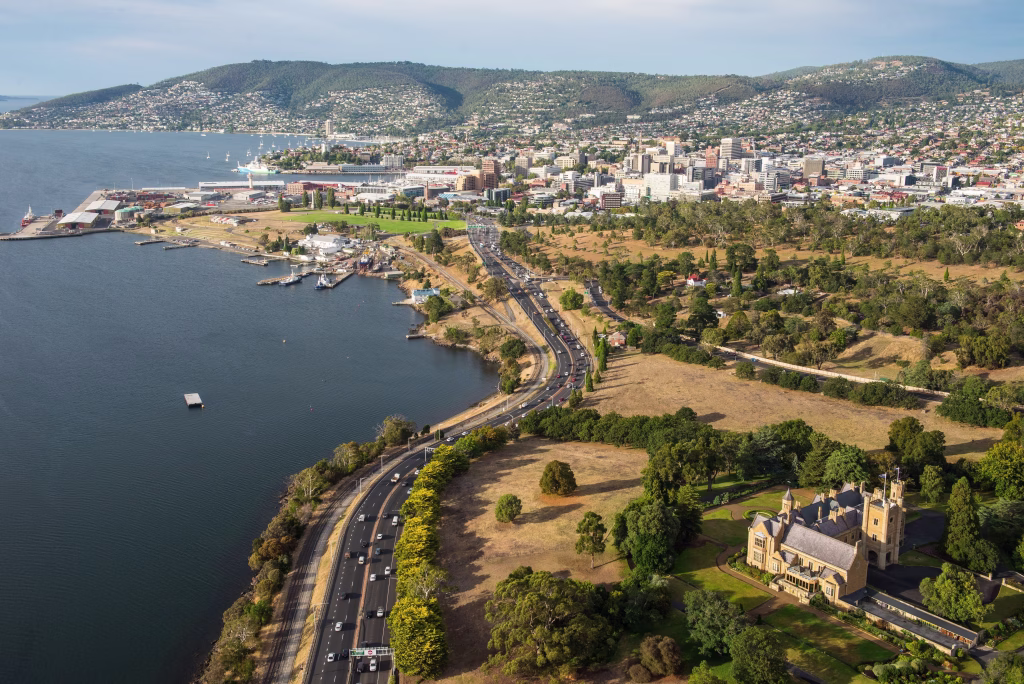 City of Hobart
An aerial of highways in Hobart, Tasmania showing government house, the water, the city buildings, and the hilly landscape in the background.