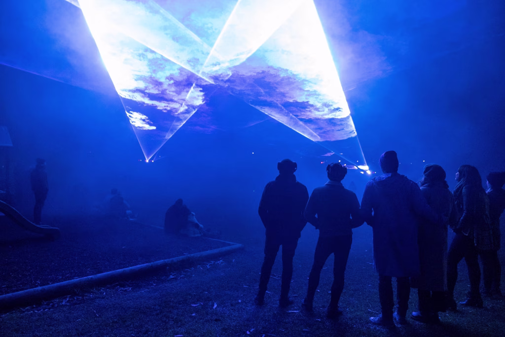 A blue scene as people gather to watch the Bicheno Beams lasers - photographed by Adam Reibel